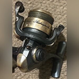 Shakespeare Microspin spinning fishing reel.